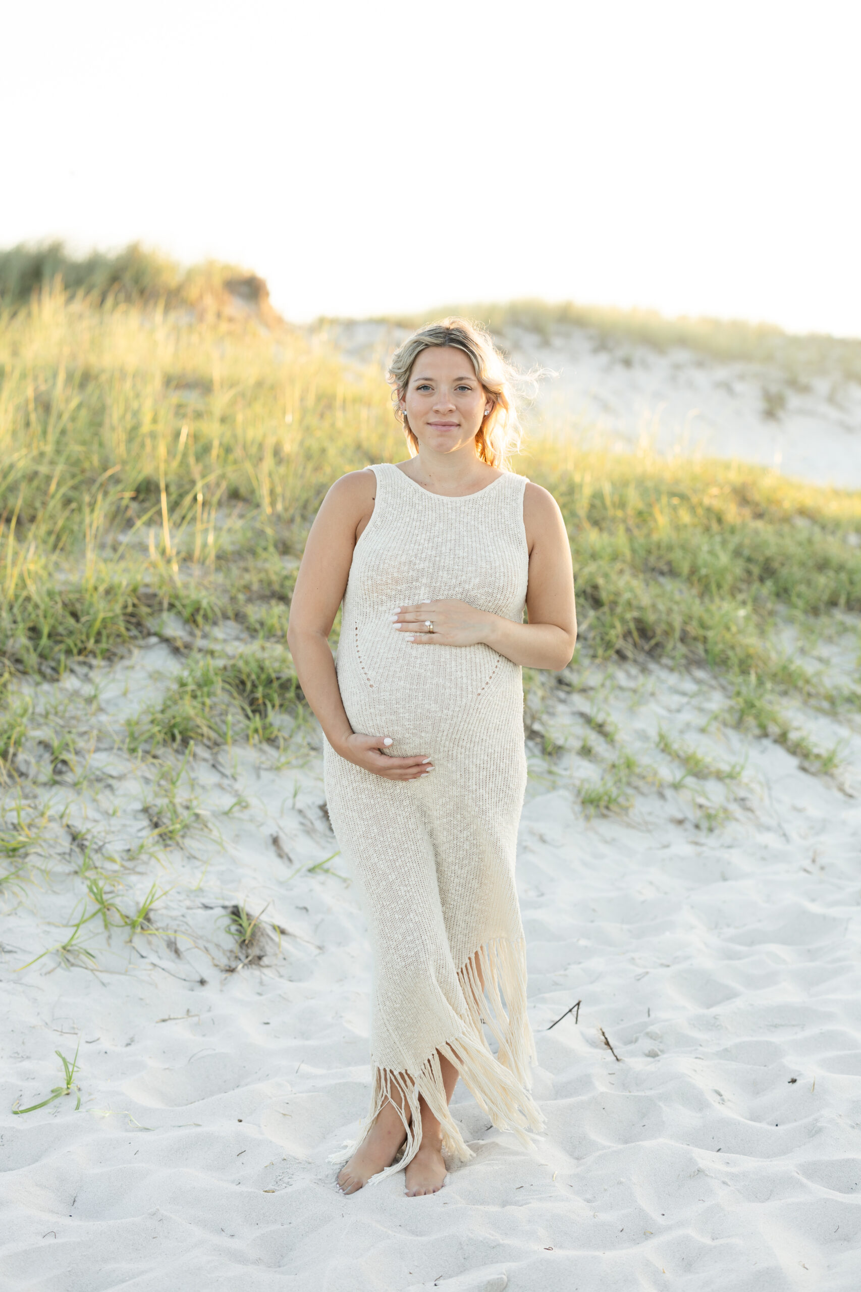 An image of a pregnant mama during her maternity session on Island Beach State Park. She was photographed by Natalie Beach Photography, a South Jersey Family Photographer.