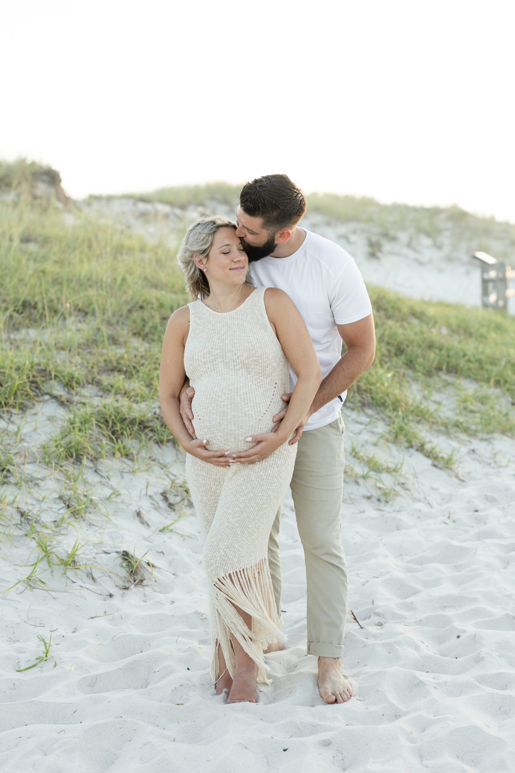 An image of a pregnant mama during her maternity session on Island Beach State Park. She was photographed by Natalie Beach Photography, a South Jersey Family Photographer.