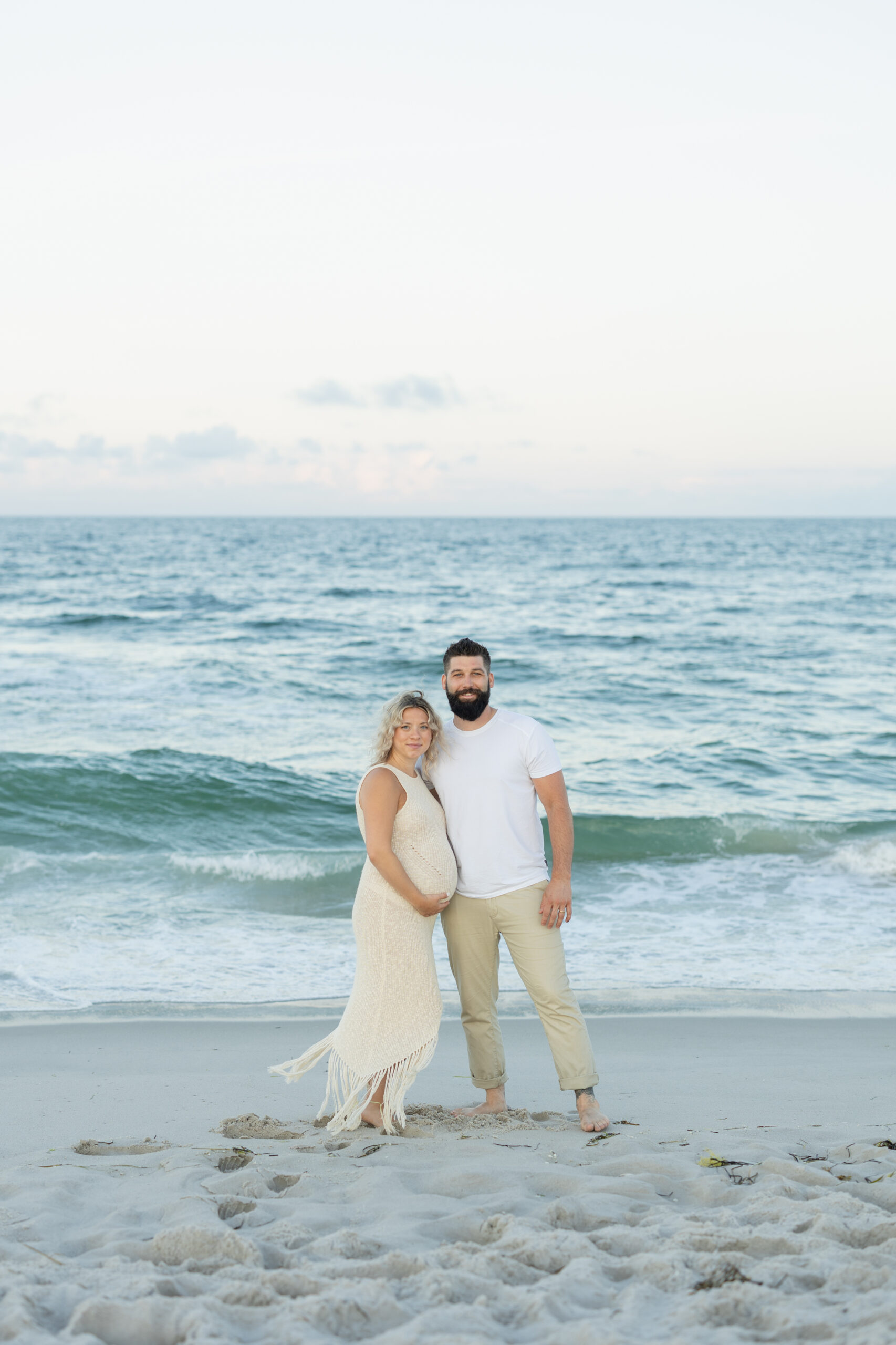An image of a pregnant mama during her maternity session on Island Beach State Park. She was photographed by Natalie Beach Photography, a South Jersey Family Photographer.