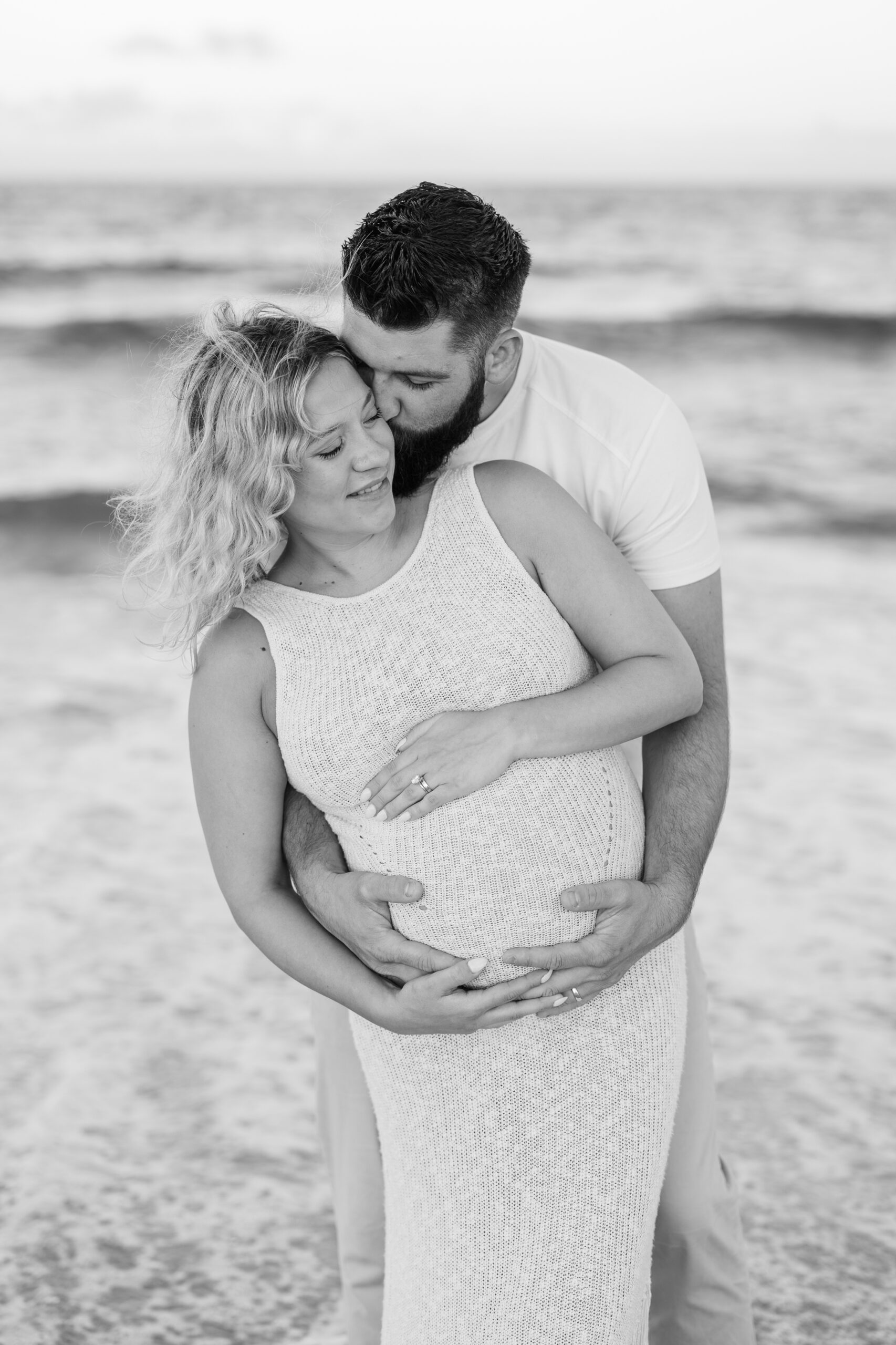 An image of a pregnant mama during her maternity session on Island Beach State Park. She was photographed by Natalie Beach Photography, a South Jersey Family Photographer.