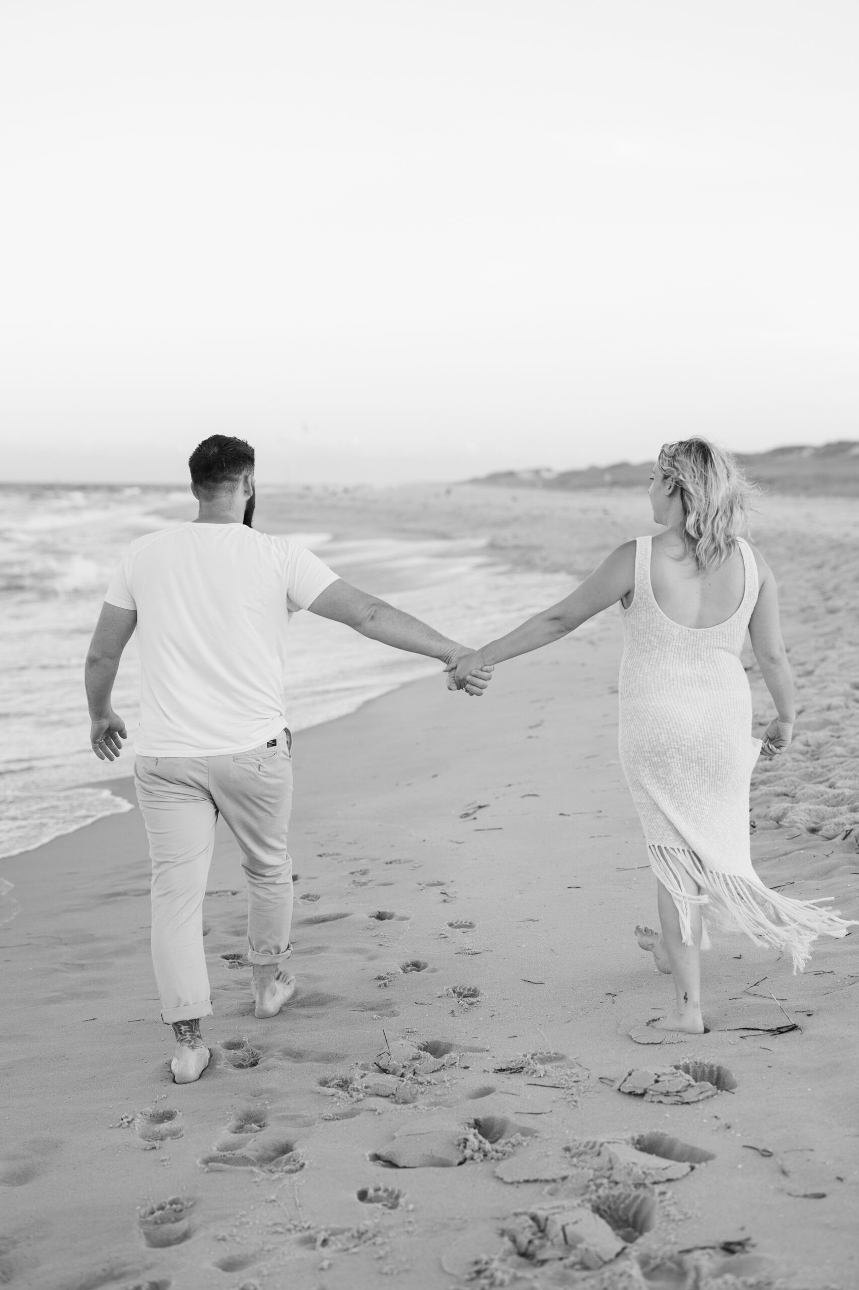 An image of a pregnant mama during her maternity session on Island Beach State Park. She was photographed by Natalie Beach Photography, a South Jersey Family Photographer.