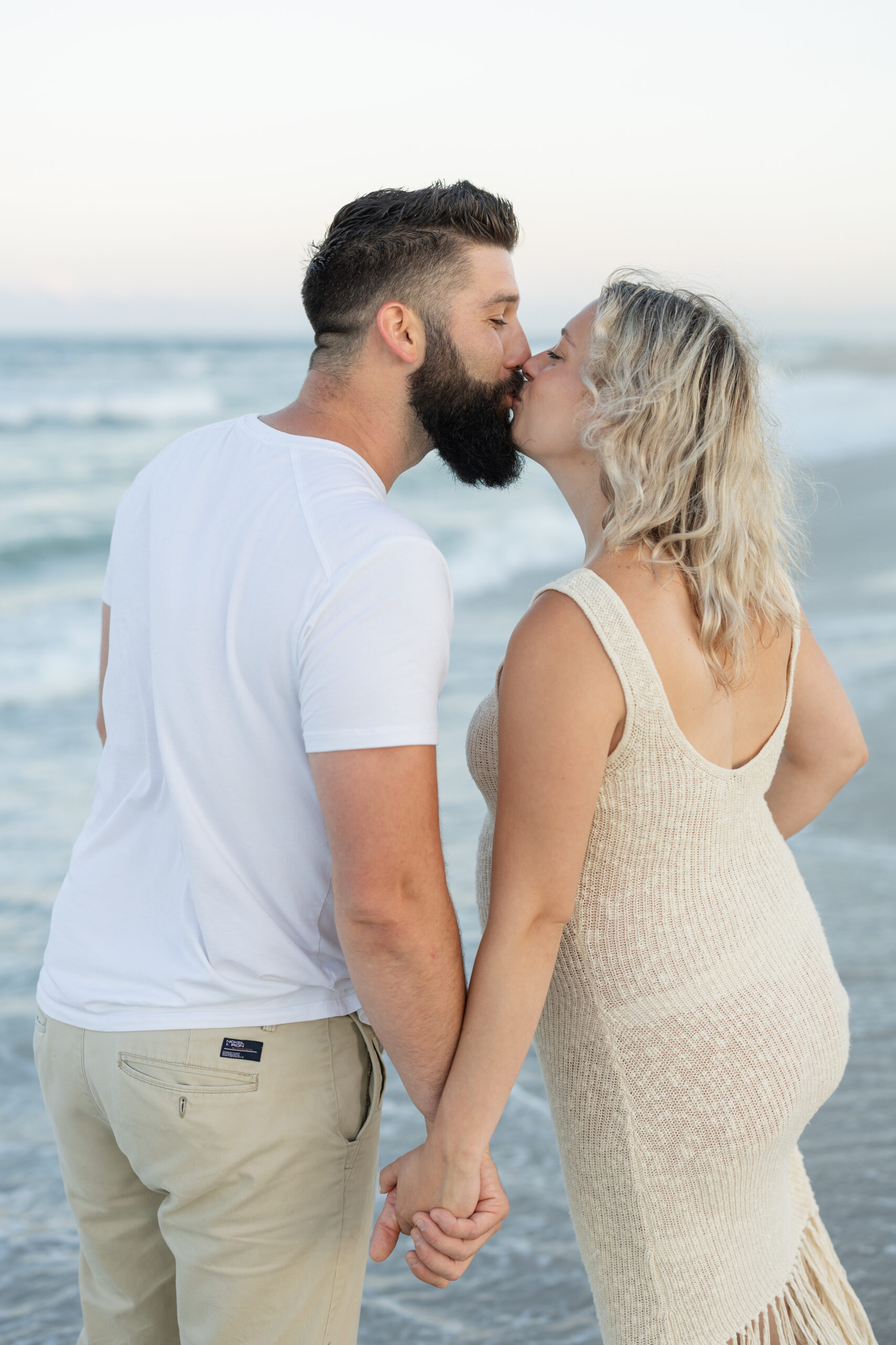 An image of a pregnant mama during her maternity session on Island Beach State Park. She was photographed by Natalie Beach Photography, a South Jersey Family Photographer.