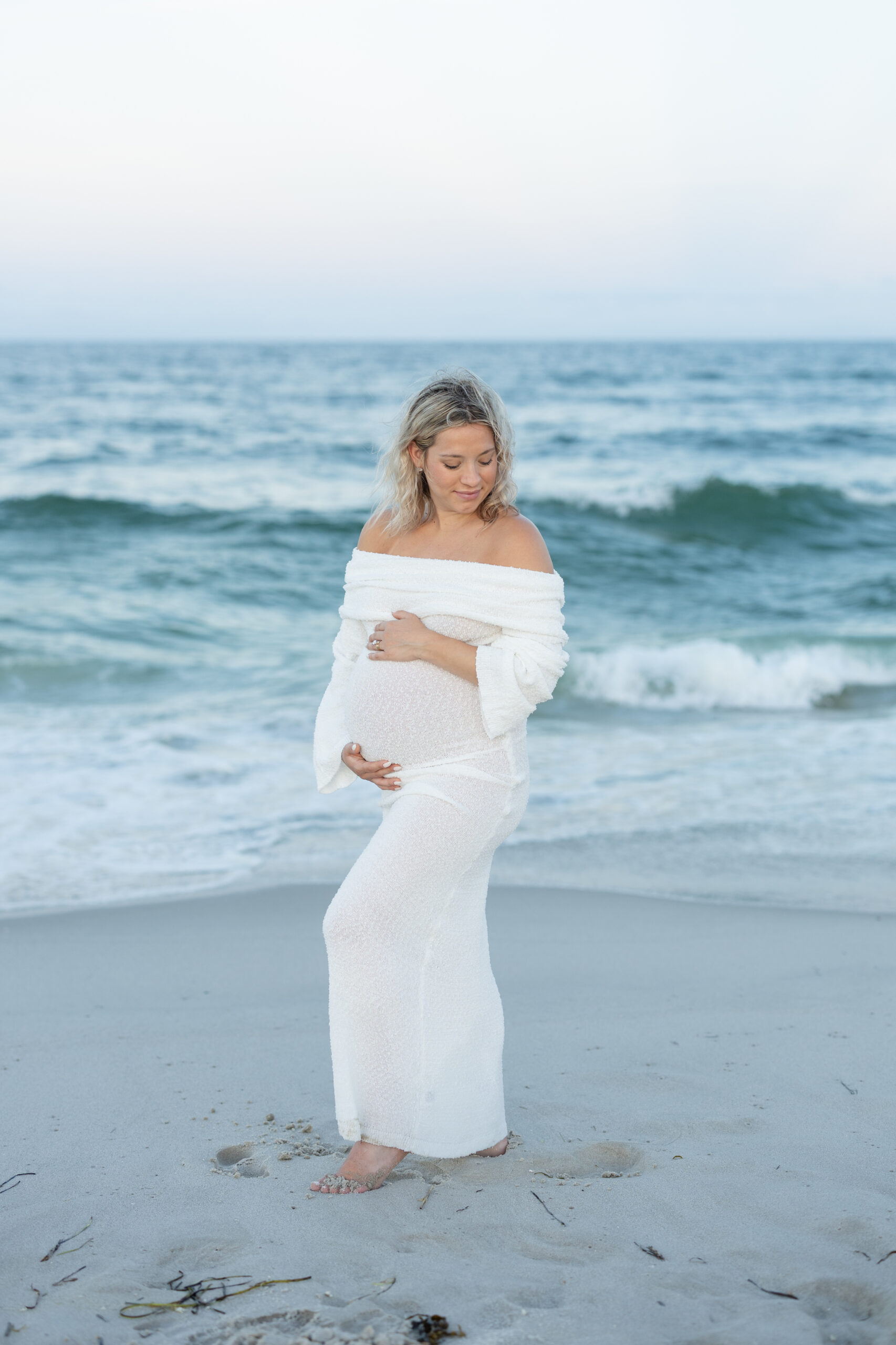 An image of a pregnant mama during her maternity session on Island Beach State Park. She was photographed by Natalie Beach Photography, a South Jersey Family Photographer.
