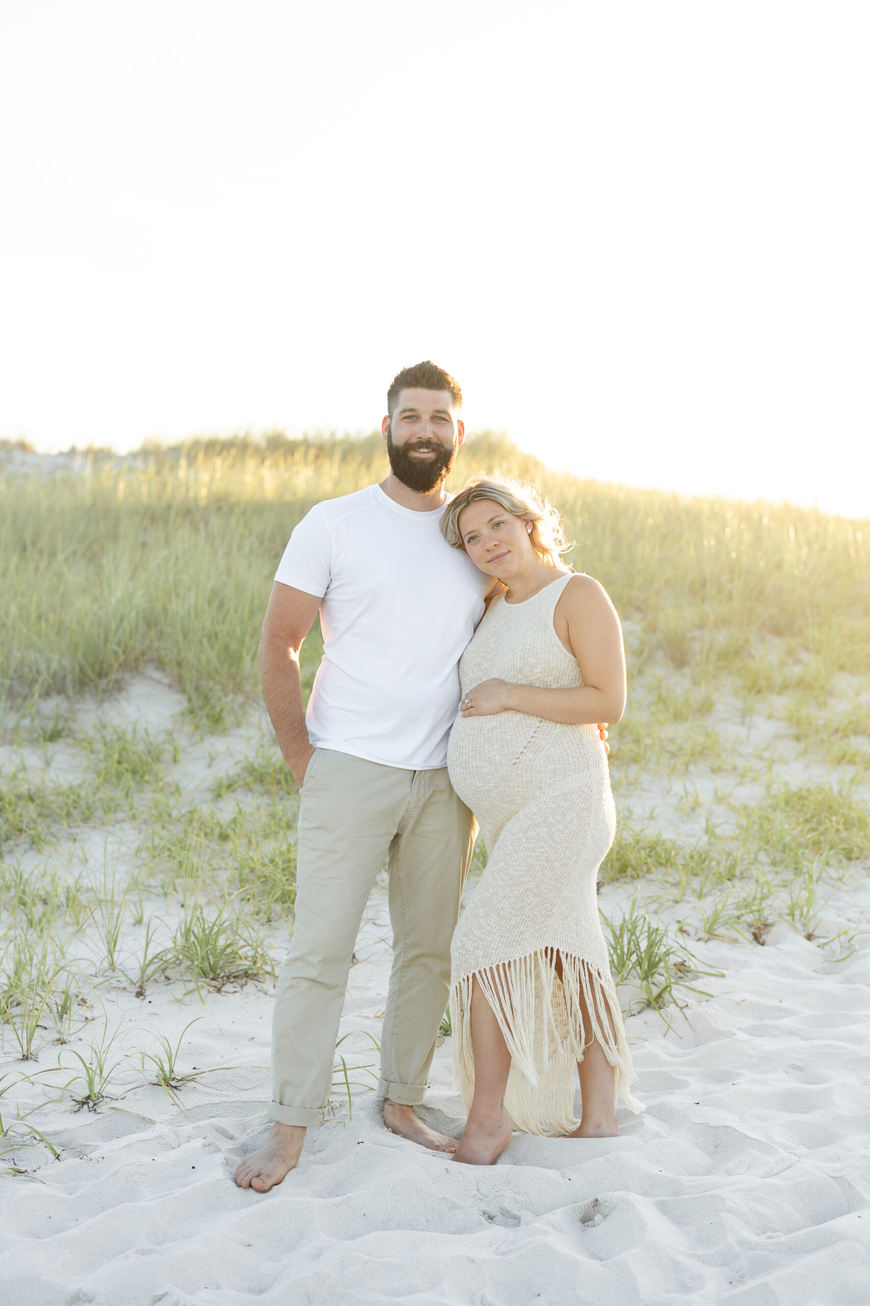 An image of a pregnant mama during her maternity session on Island Beach State Park. She was photographed by Natalie Beach Photography, a South Jersey Family Photographer.